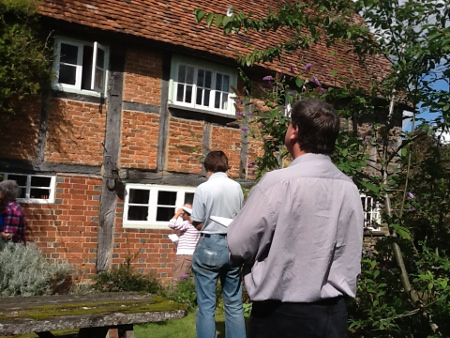 Members of the Wealden Buildings Study Group at a timber-framed house.